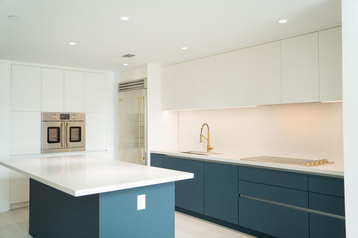Blue and white modern kitchen cabinetry in Biscayne